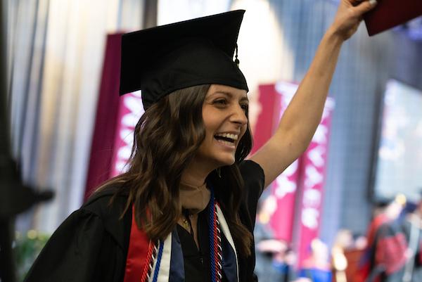 Student with french flag stole cheering at graduation